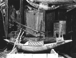 Image of many objects stacked inside tomb