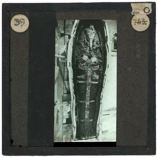 Image of lantern slide of mummy lying in coffin