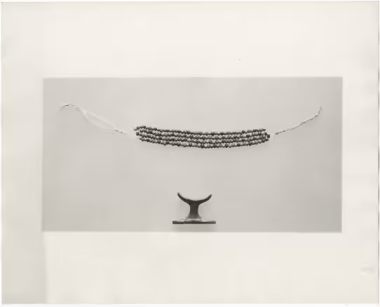 Image of print of jewellery and small amulet