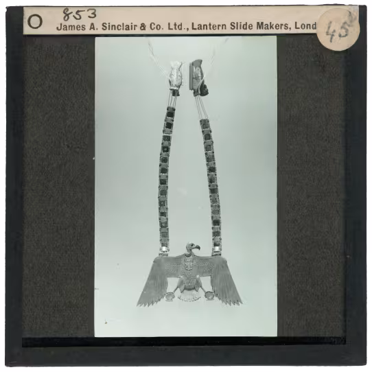 Image of lantern slide of necklace with vulture
