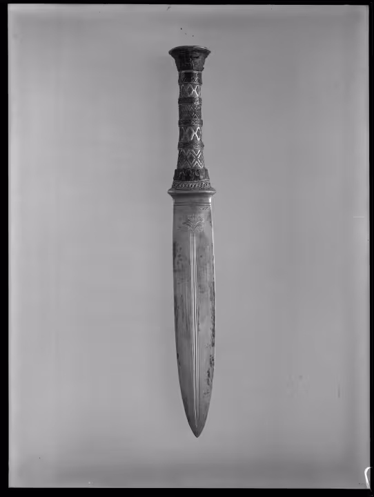 Image of negative of dagger with decorated handle