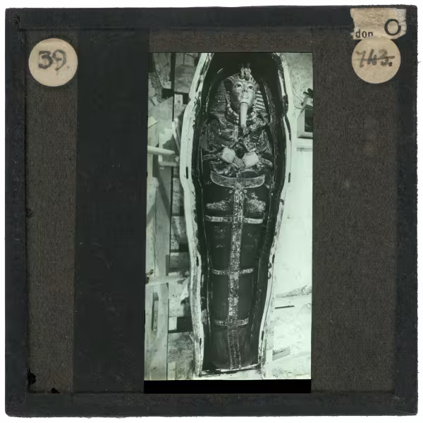 Image of lantern slide of mummy lying in coffin