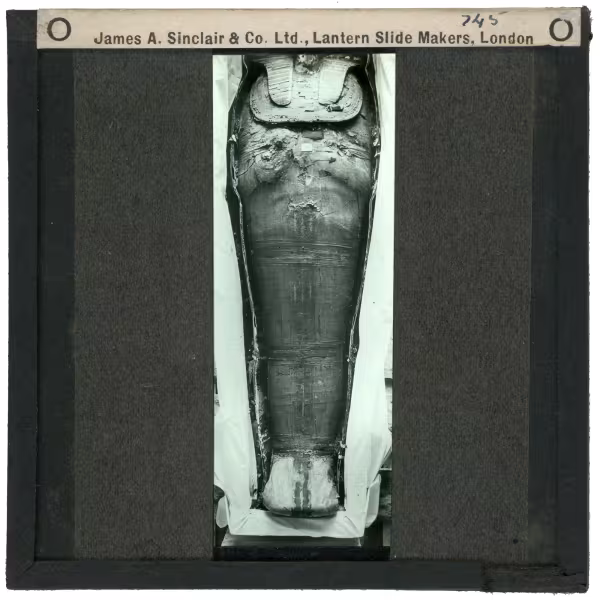 Image of lantern slide of king's mummy lying in coffin