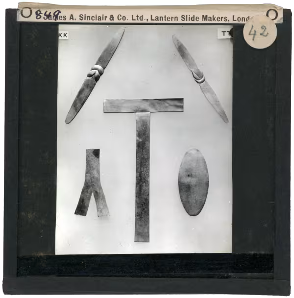 Image of lantern slide of five flat amulets