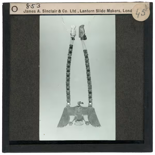 Image of lantern slide of necklace with vulture