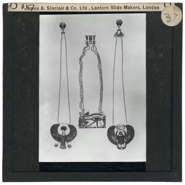 Image of lantern slide with three necklaces