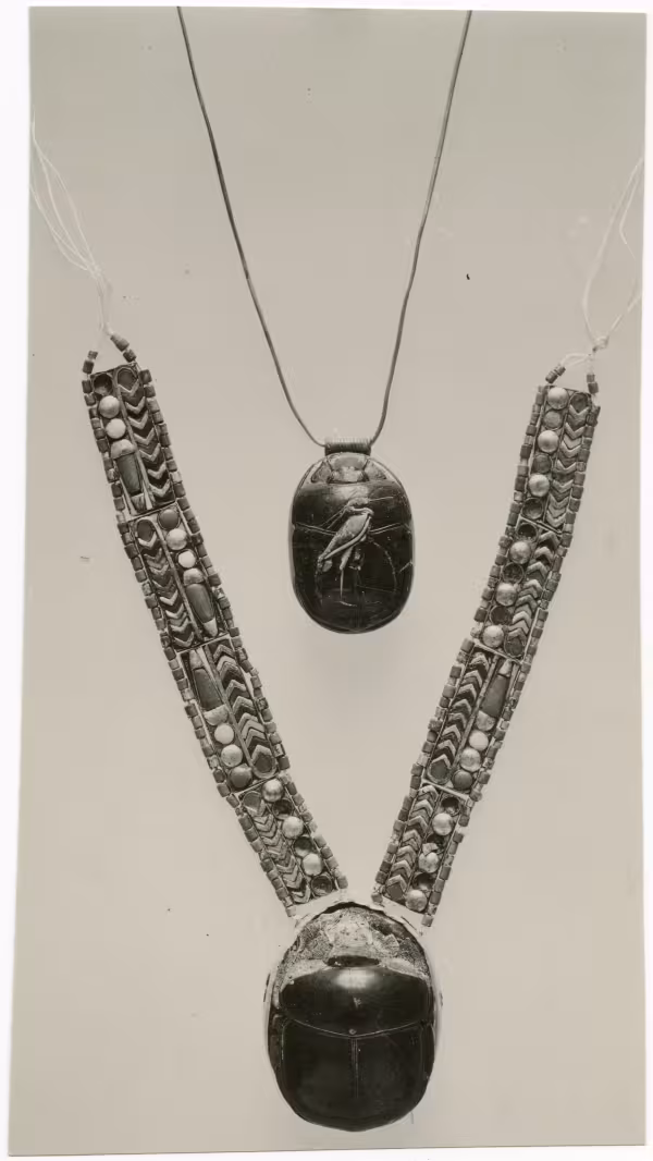 image of photographic print of two scarab pectorals in object card