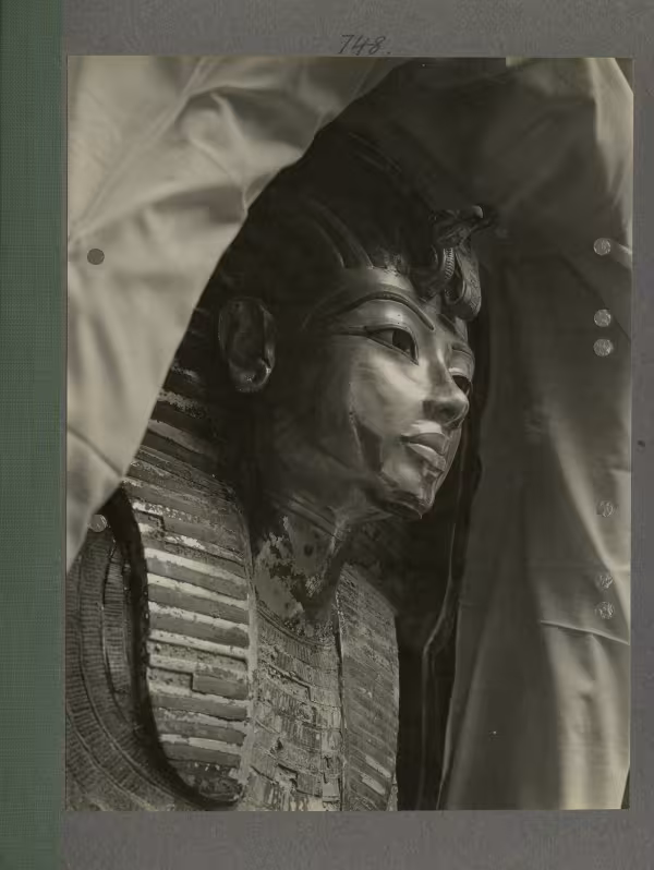 image of king's mask within coffin from Burton's album