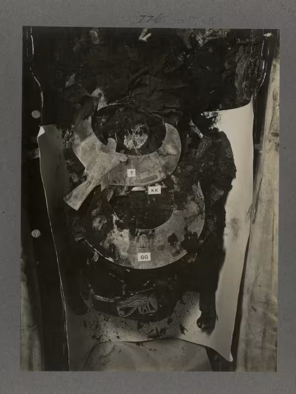 image of king's mummy during unwrapping, showing various amulets and jewellery, from Burton's album