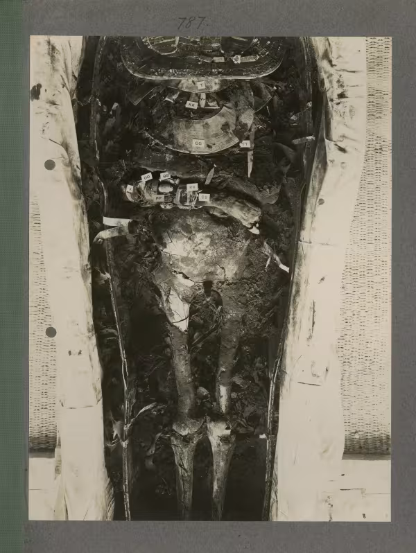 image of king's mummy during unwrapping within coffin from Burton's album