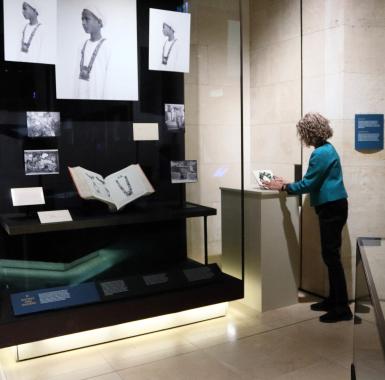 figure placing wreath in museum