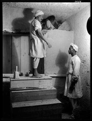 Egyptian workers inside tomb