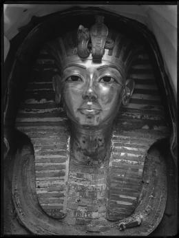 Image of gold mask of king within coffin negative