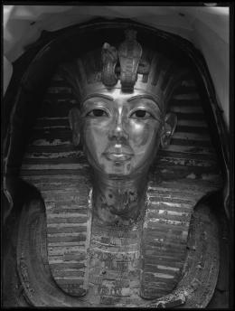 Image of gold mask of king within coffin negative