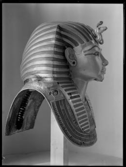 Image of gold mask of king negative