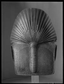 Image of back of gold mask of king negative