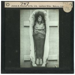 Image of lantern slide of mummy lying in coffin