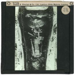 Image of lantern slide of king's mummy lying in coffin