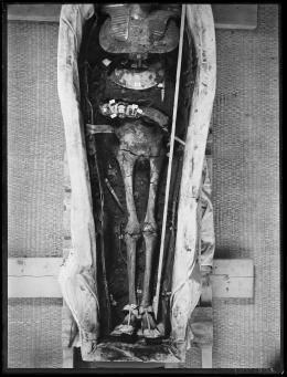 Image of negative of the king's mummy showing objects found in wrappings