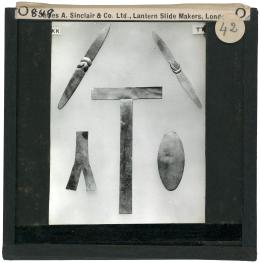 Image of lantern slide of five flat amulets