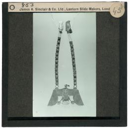 Image of lantern slide of necklace with vulture