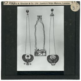Image of lantern slide with three necklaces