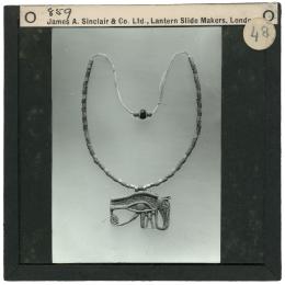 Image of lantern slide of necklace with eye amulet