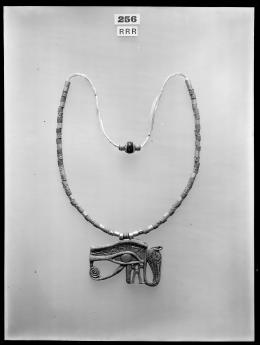 Image of photographic print of necklace with eye amulet