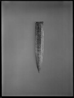 Image of negative of embossed dagger sheath