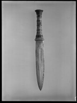 Image of negative of dagger with decorated handle