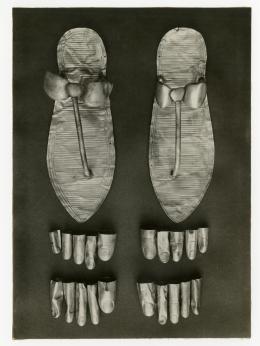 Image of photographic print of a pair of sandals and toe and finger stalls
