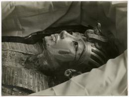 Image of print of king's mask in coffin