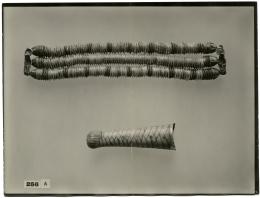 image of photographic print of necklace and beard previously attached to the king's mask in object card