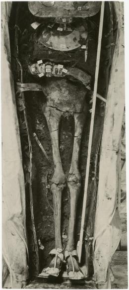 image of photographic print of lower part of king's unwrapped body within coffin in object card
