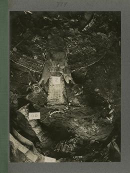 image of torso of king's mummy during unwrapping within coffin from Burton's album