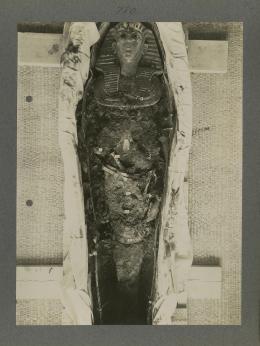 image of king's mummy during unwrapping within coffin from Burton's album