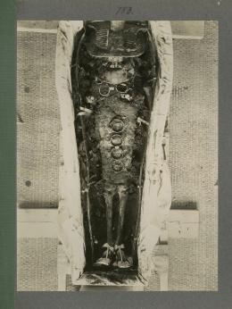 image of king's mummy during unwrapping within coffin from Burton's album