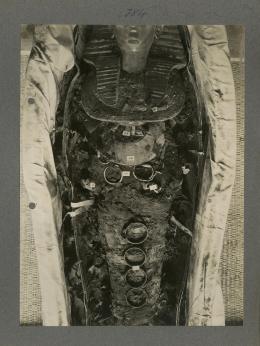 image of king's mummy during unwrapping within coffin from Burton's album