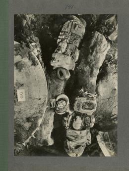 image of king's mummy during unwrapping, focusing on the arms, from Burton's album